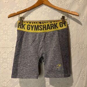 Gymshark tight fitted short with the thick yellow waistband